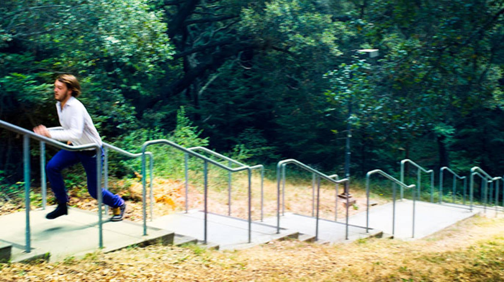 student climbs outdoor stairs