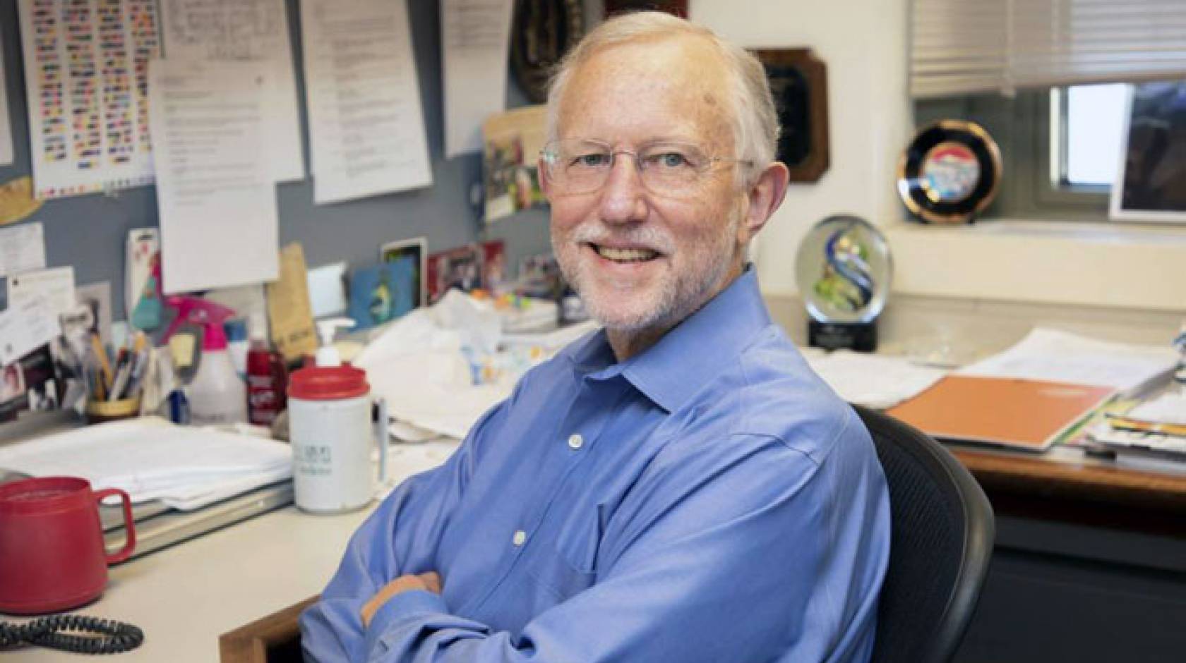 Charles Rice at desk