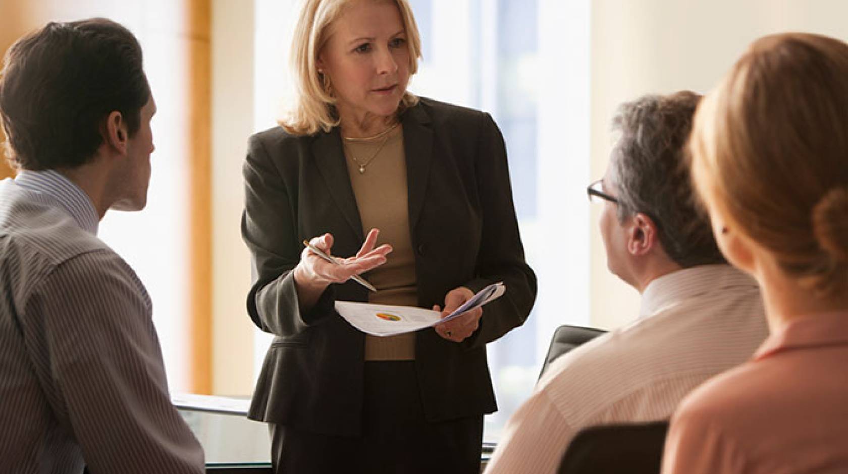 woman executive talks with colleagues