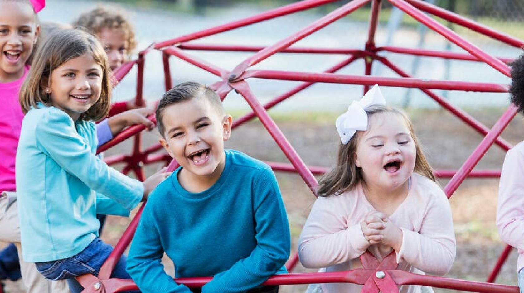 A diverse group of happy children on a playground