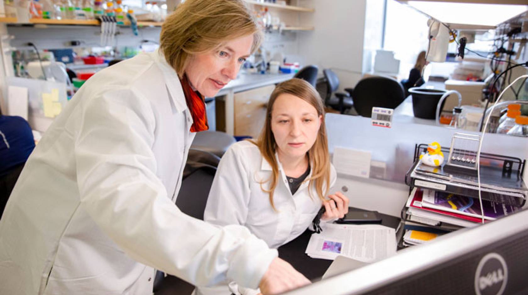 Doudna in a lab with a colleague