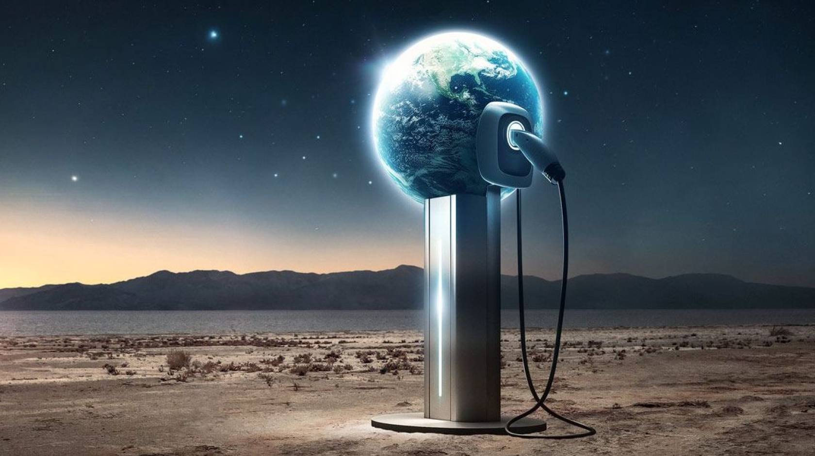 In a desert scene, an electric charger is plugged into a globe