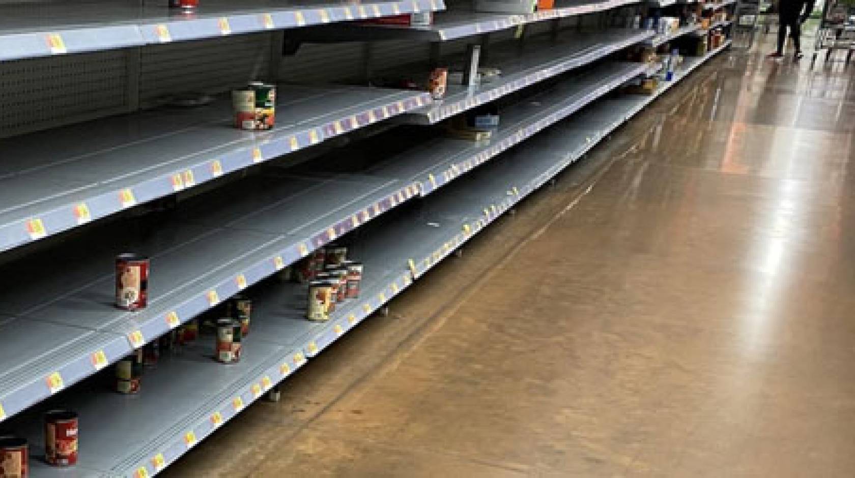 Nearly empty shelves in a store