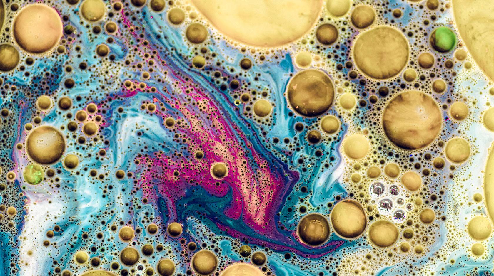 A colorful close-up of oil and water mixing