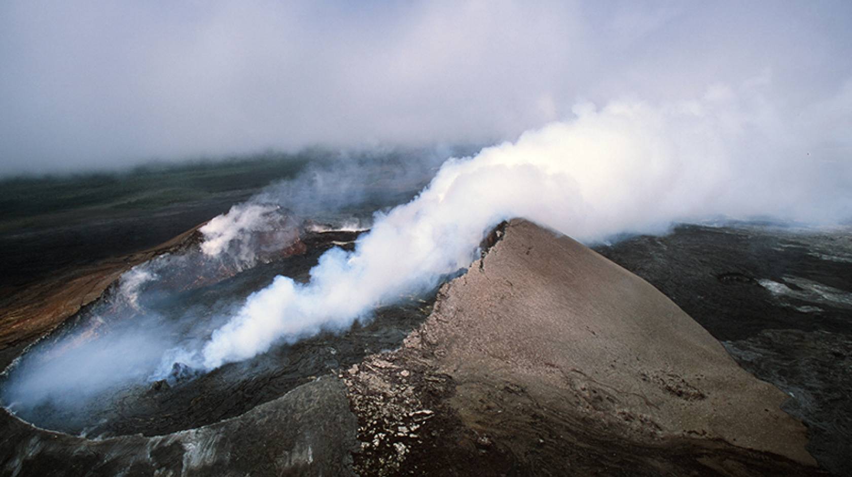 Kīlauea volcano in Hawaii smoking, seen from above