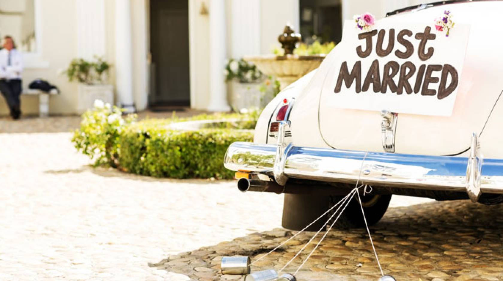 Just married old car in a sunny square