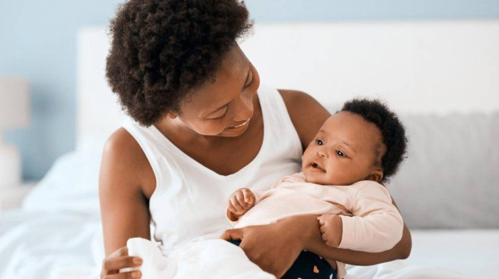 Black mother holding her baby