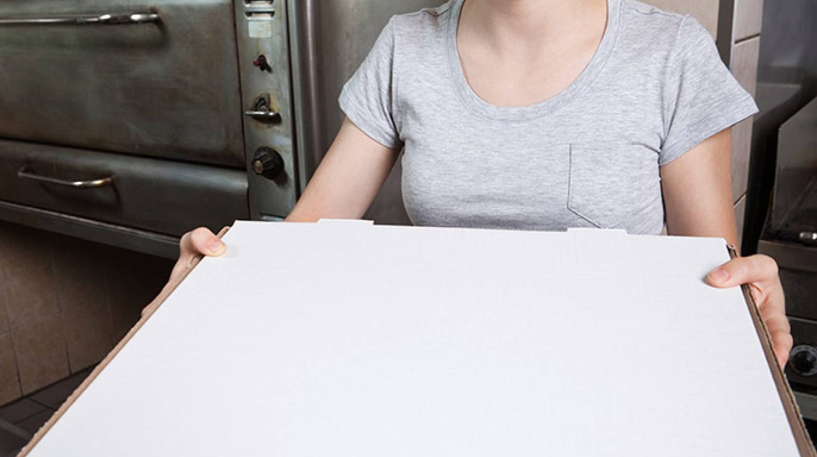 young woman working at pizza parlor