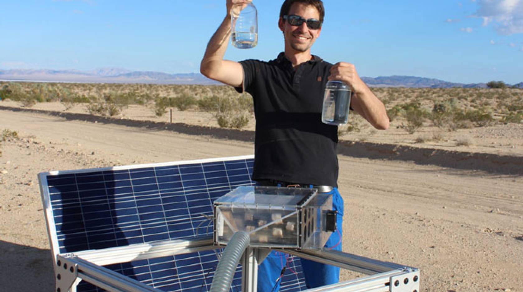 Mathieu Prévot displays water collected by the harvester