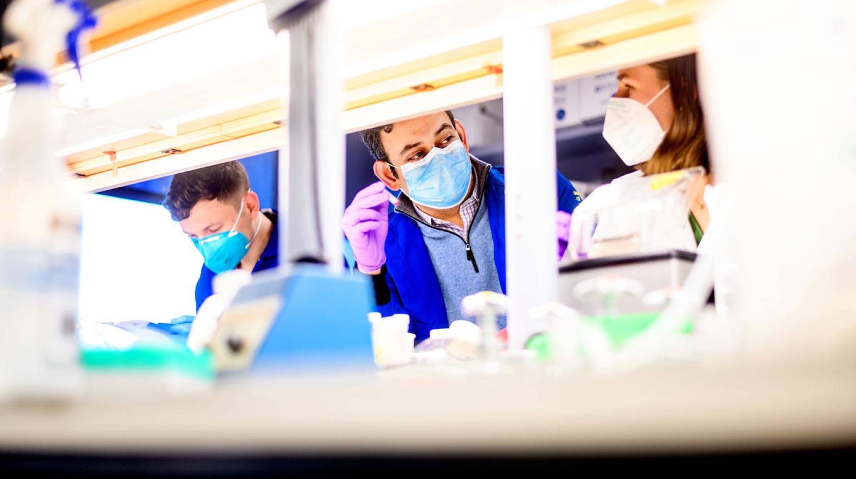 Dr. Sagar Bapat speaks with staff research associate Sarah Gayer in his lab at UCSF’s Parnassus campus.