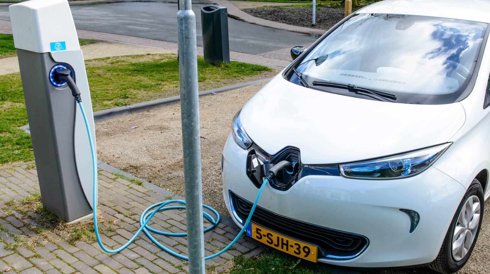 Charging Renault Zoe electric car on a parking place in the city of Zwolle, The Netherlands.