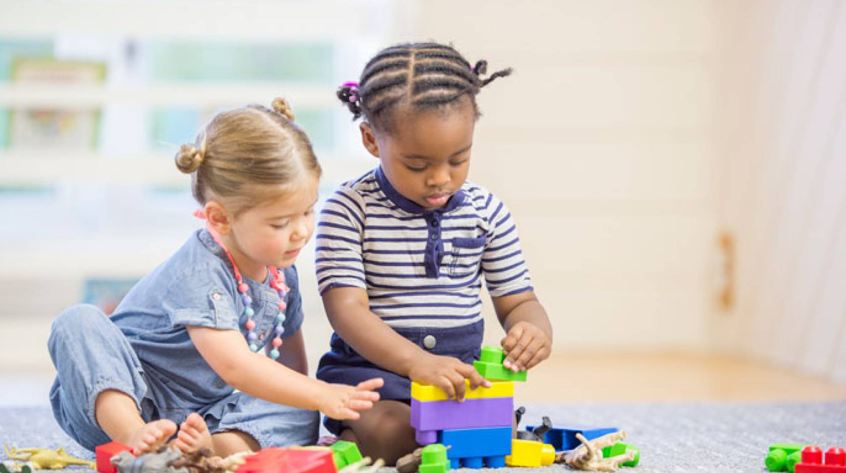 Two young children play together