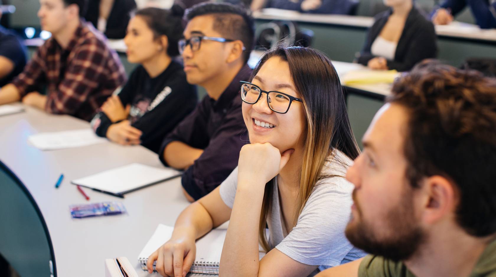 smiling college students in a classroom