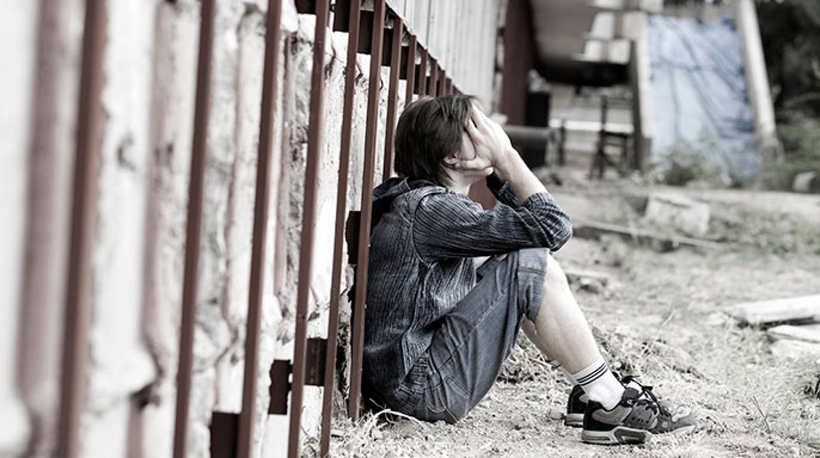 teen seated outdoors