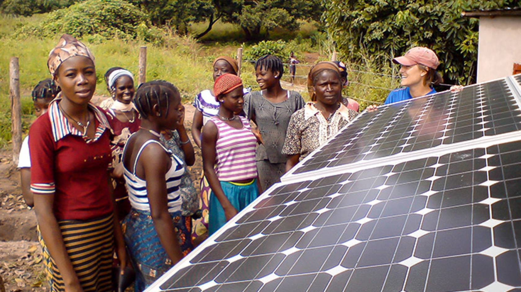 Jennifer Burney with solar panels