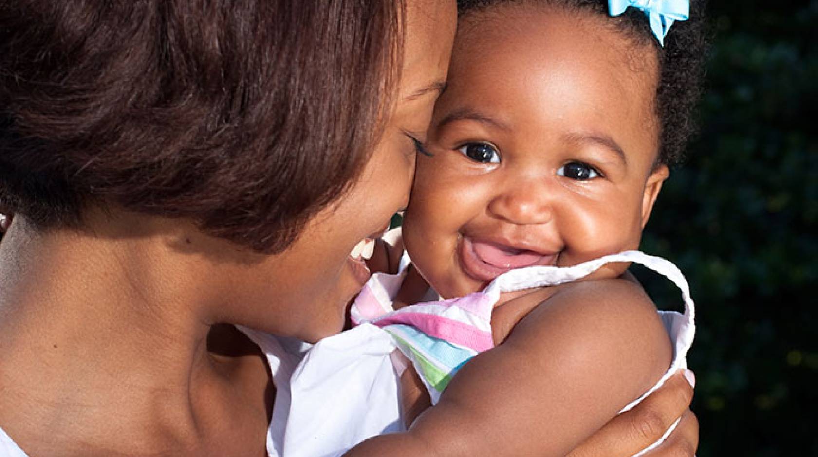 Babies time their smiles to make their moms smile back