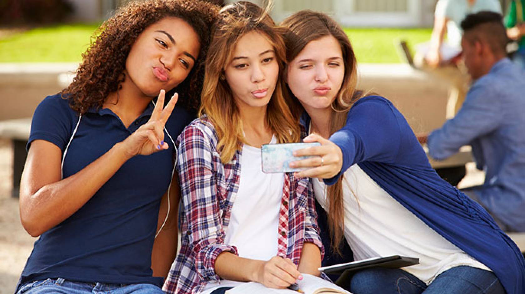 teen girls taking selfie