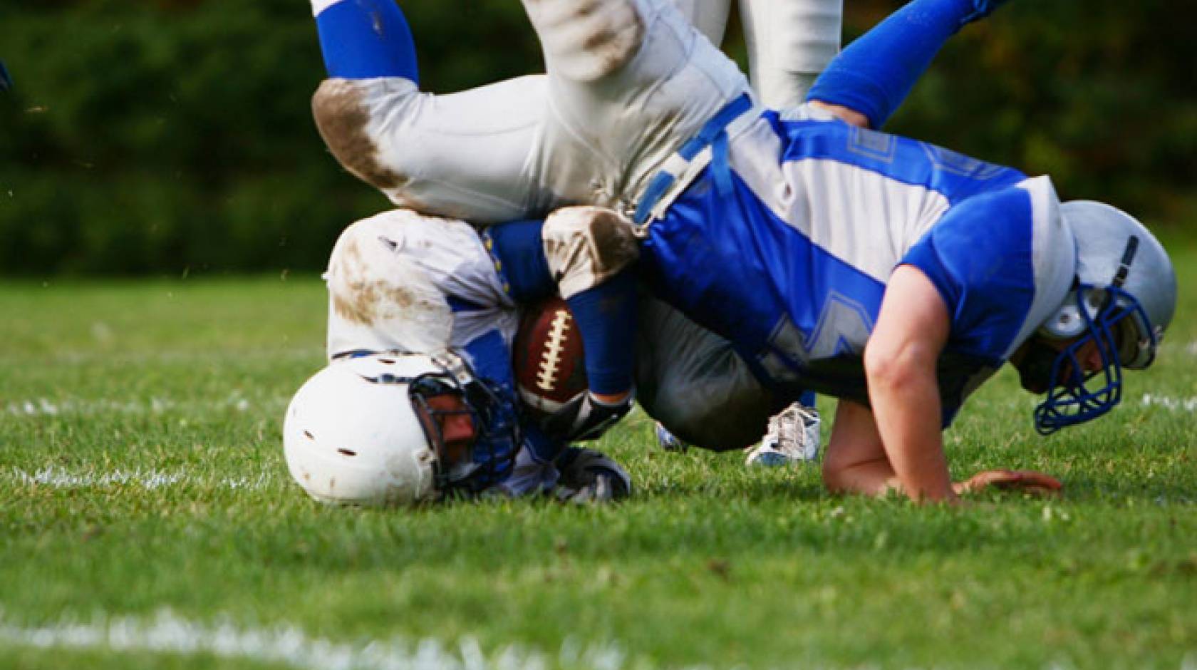 Two boys playing football