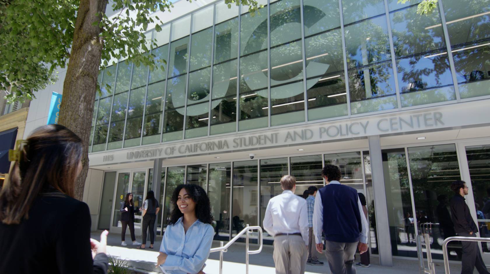 Exterior view of the UC Student and Policy Center, with people walking around outside