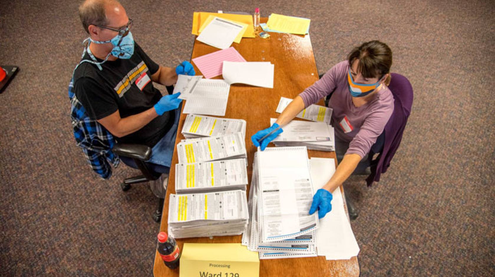 Election workers processing ballots