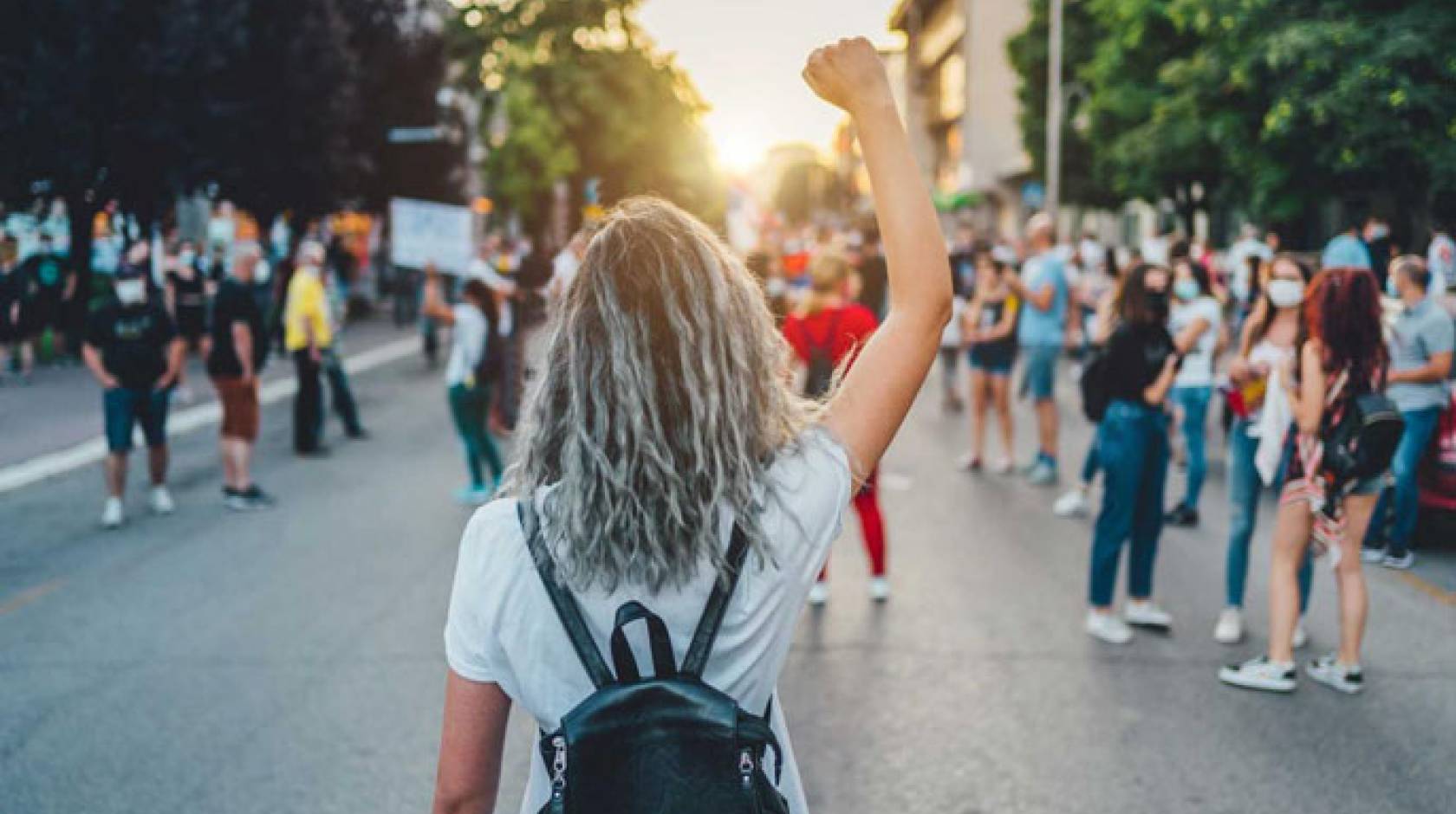 Women marching down the street protesting