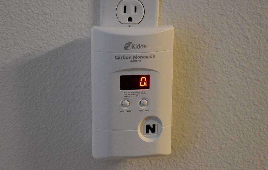 Carbon monoxide detector plugged into a wall outlet