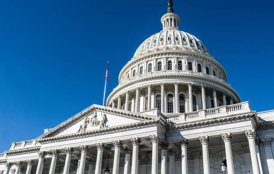 H.R. 1 bill The U.S. Capitol building viewed from an angle against a bright blue sky