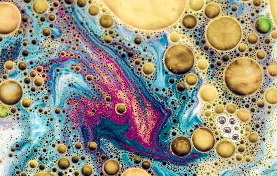 A colorful close-up of oil and water mixing