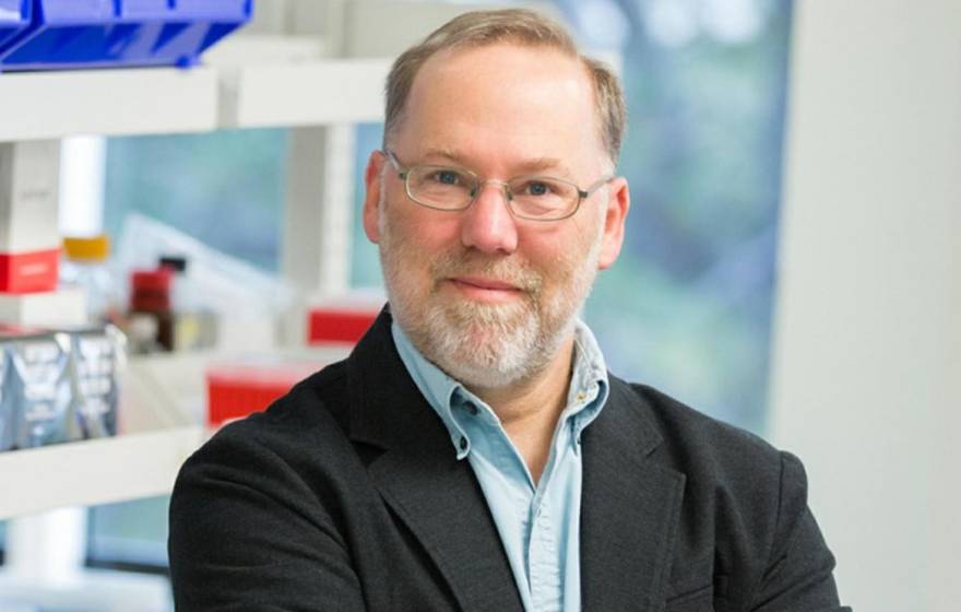 Fred Ramsdell, Nobel Prize winner A man with a beard in glasses smiles in a lab