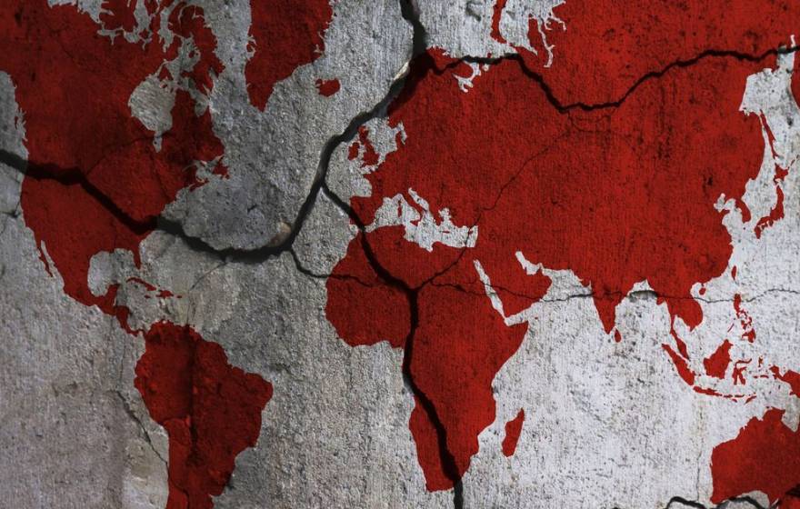 Illustration of a world map. Continents are red, oceans are white, and the map is crossed with dark fault lines, lending a doomy effect