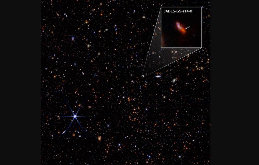 A view of stars with one box highlighting a specific galaxy, labelled JADES-GS-z14-0