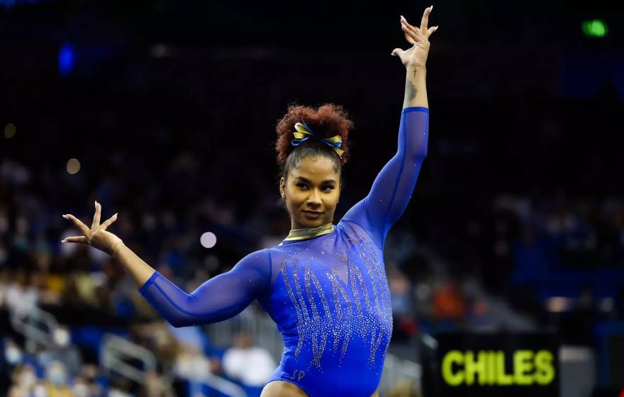 Jordan Chiles poses dramatically in a leotard in competition