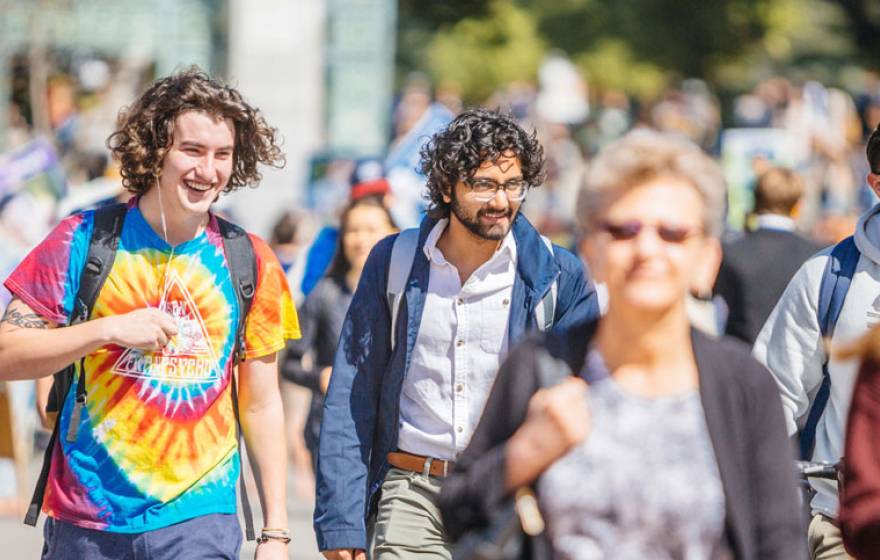 Happy students walking on campus