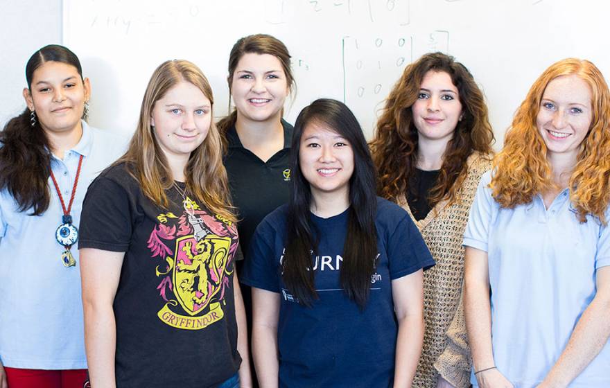 Female STEM students standing together