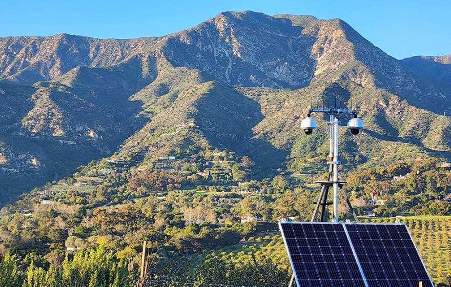 View of Ortega Ridge near Santa Barbara and cameras fitted with solar panels in the foreground