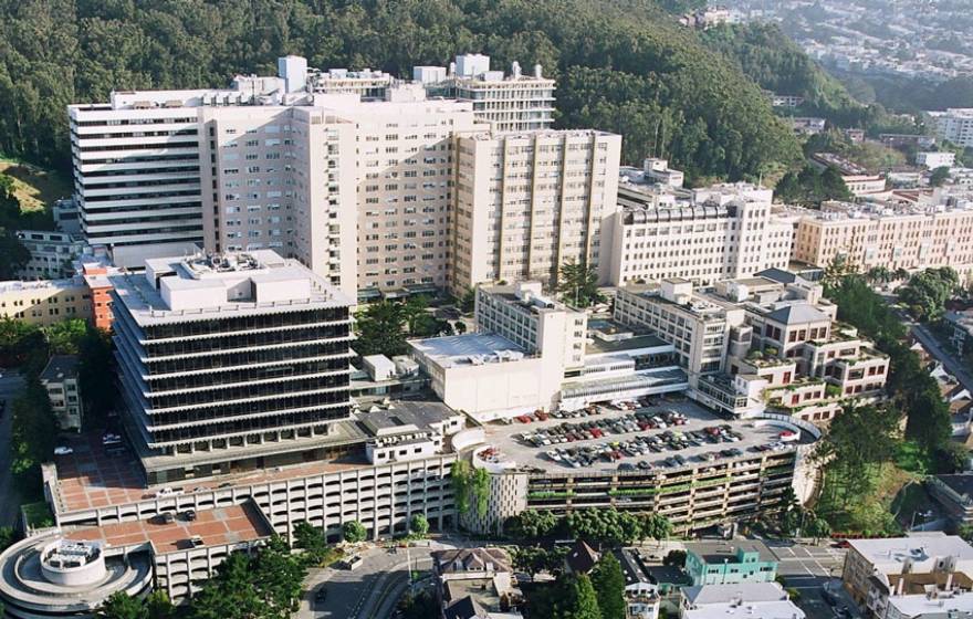 UCSF campus Aerial view of the UCSF Parnassus campus, white buildings at the base of a hill with trees