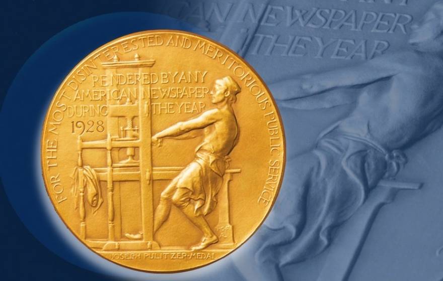 Pulitzer Prize gold medal on a blue background