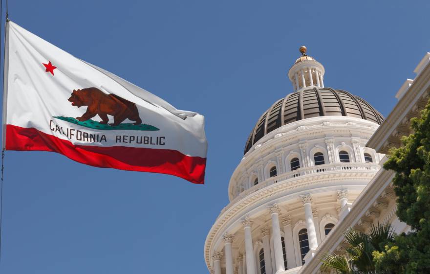 California flag flying outside the capitol building in Sacramento