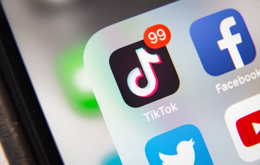 TikTok TikTok and other social media icons on a phone
