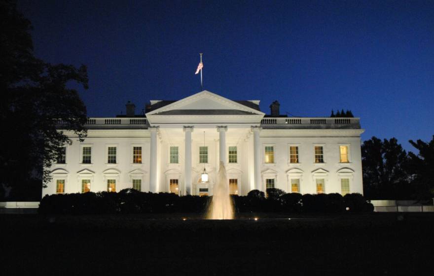 The front of the White House lit up at night