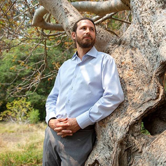 Peter Nelson standing in front of a tree outside