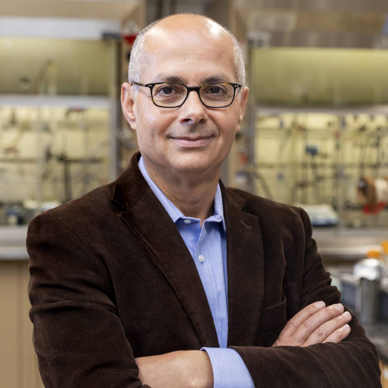 UC Berkeley professor Omar Yaghi wins the Nobel Prize in chemistry A man with glasses in a brown jacket smiles at the camera in a lab (Omar Yaghi)