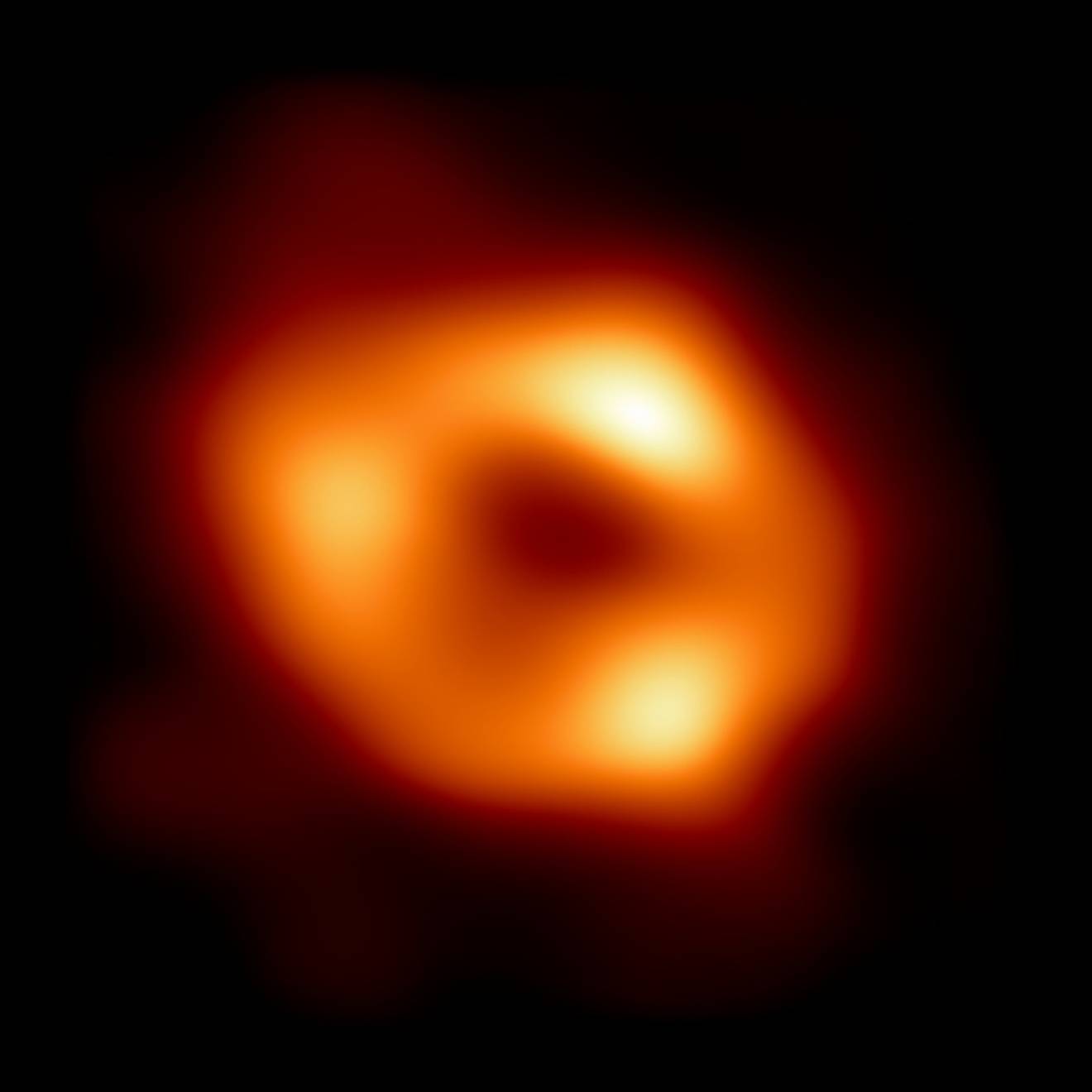 The first image of Sagittarius A* (or Sgr A* for short), the supermassive black hole at the centre of our galaxy. Fiery red circular object on black