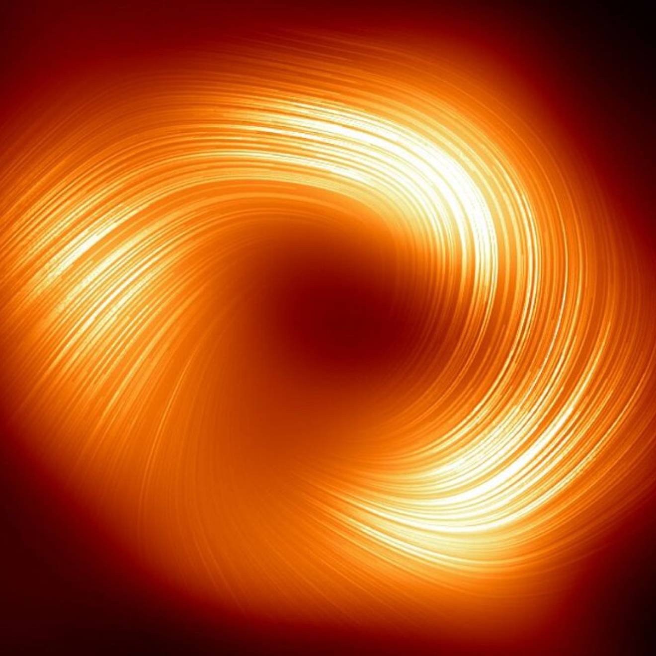 A swirl of yellow-red light against a black background