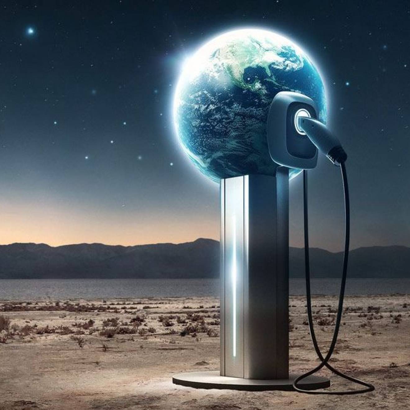 In a desert scene, an electric charger is plugged into a globe