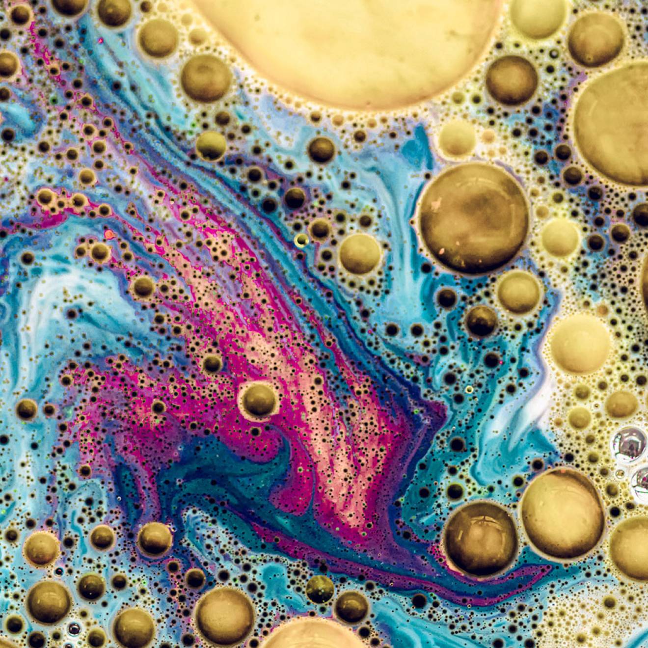 A colorful close-up of oil and water mixing