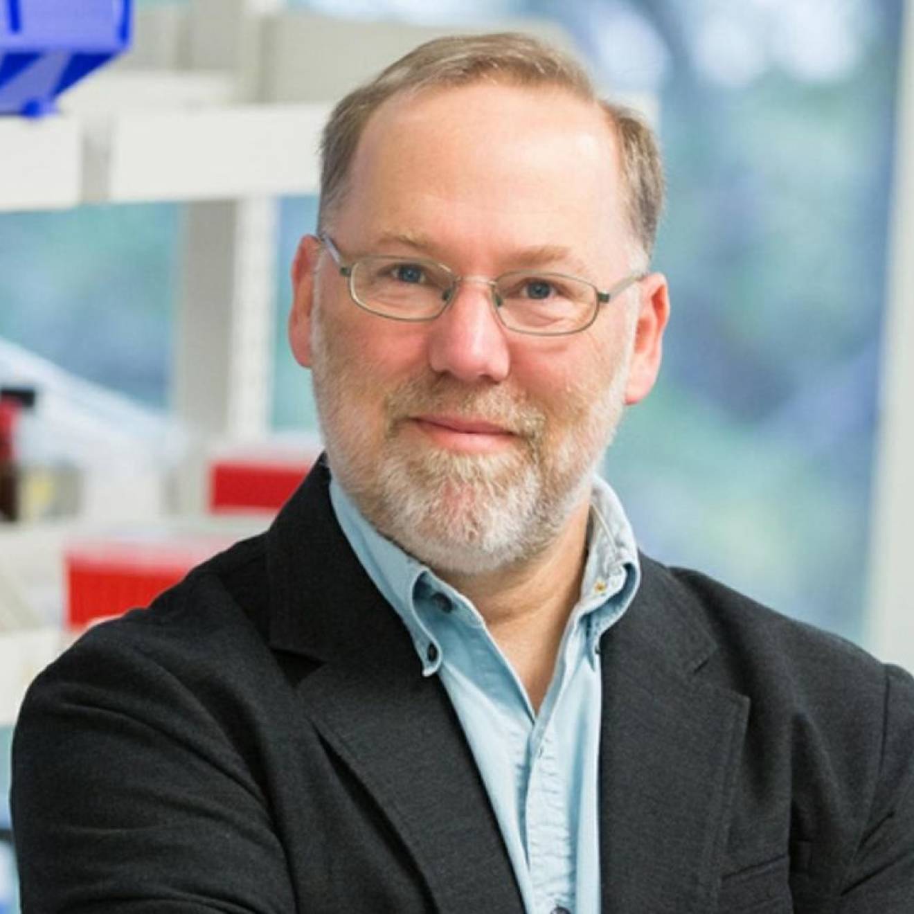 Fred Ramsdell, Nobel Prize winner A man with a beard in glasses smiles in a lab