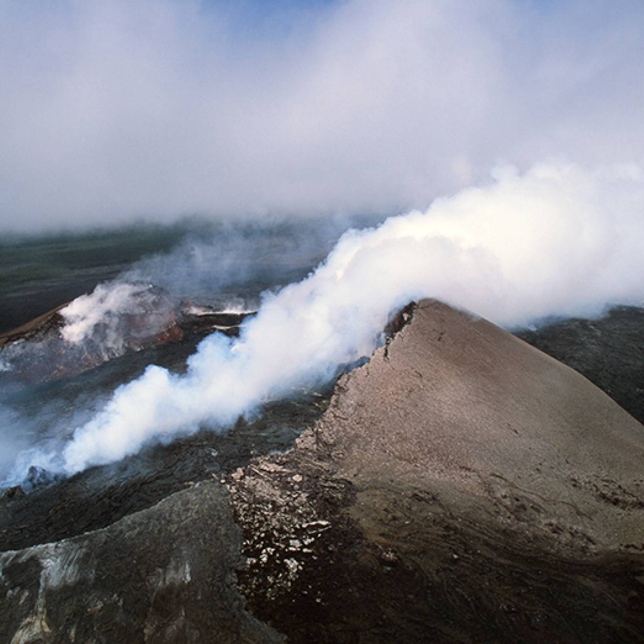 Kīlauea volcano in Hawaii smoking, seen from above