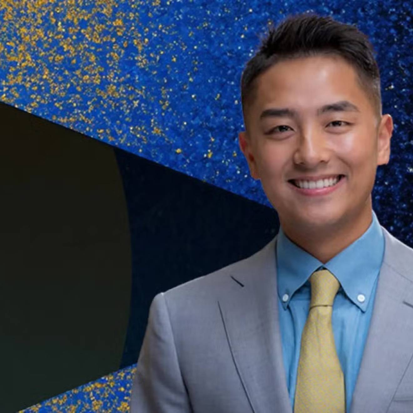 Ike Zhan Young man in a suit smiling with John Wooden Leadership Fellows text on the left