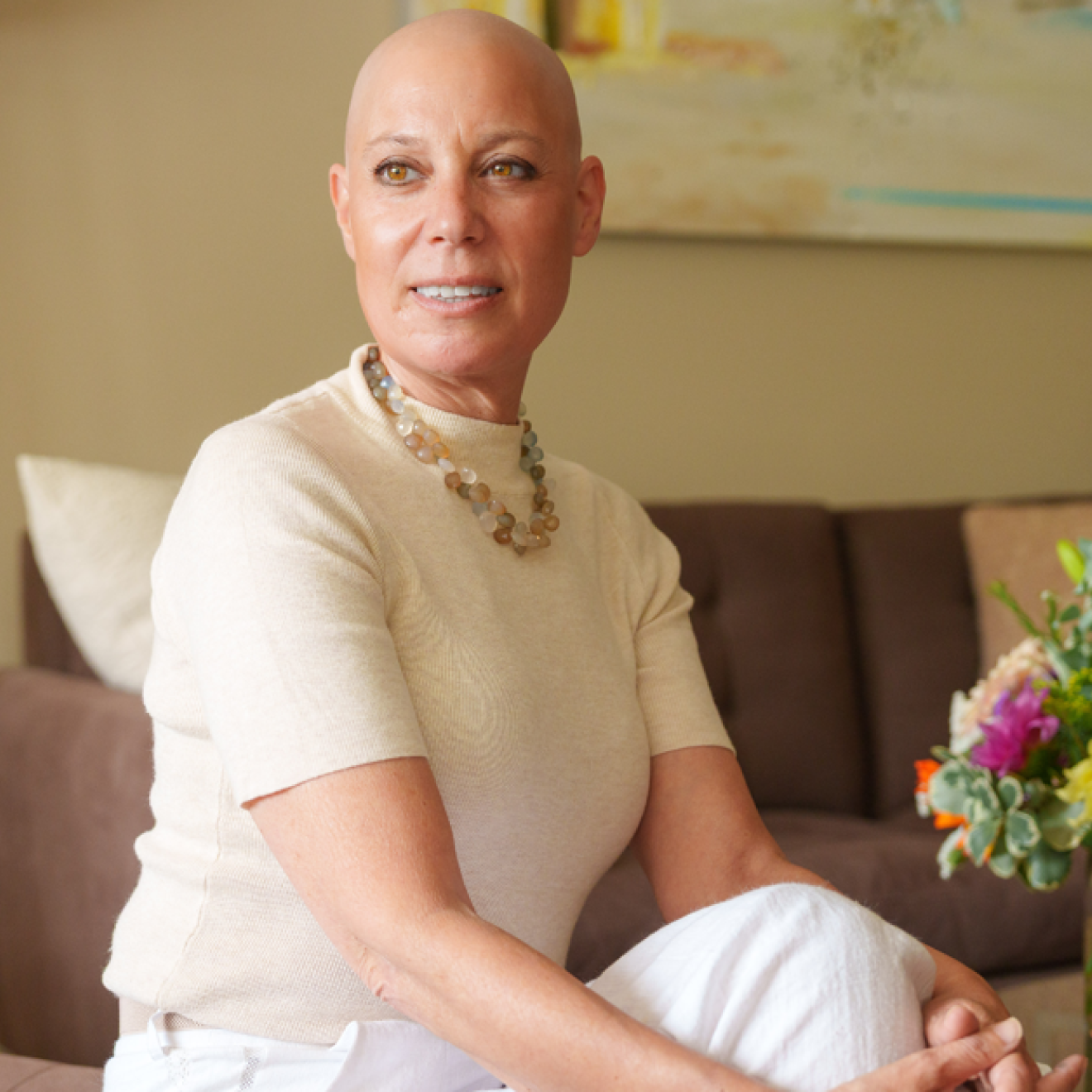 A plea to protect research funding Well-dressed woman without hair on her head from chemotherapy looks into the distance